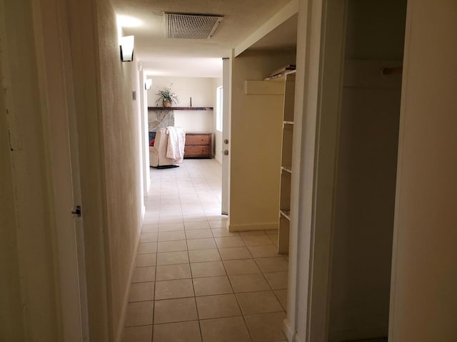 hallway featuring light tile patterned flooring