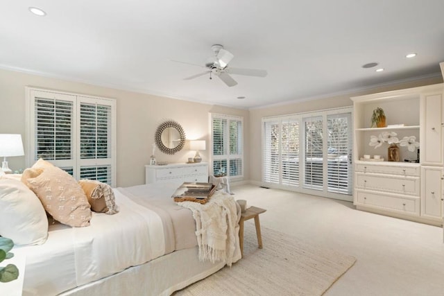 carpeted bedroom featuring ceiling fan, access to exterior, and ornamental molding