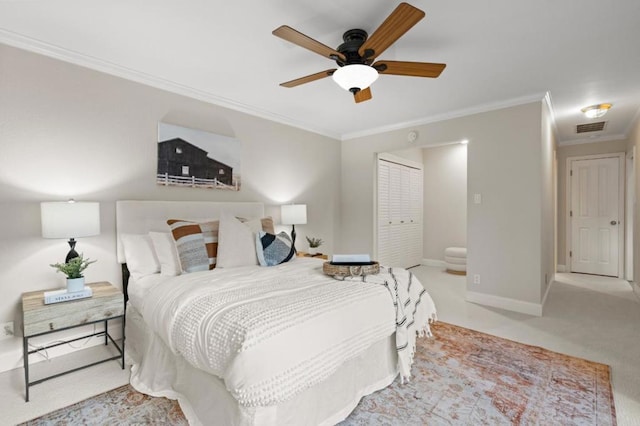 bedroom featuring ceiling fan, light colored carpet, a closet, and ornamental molding