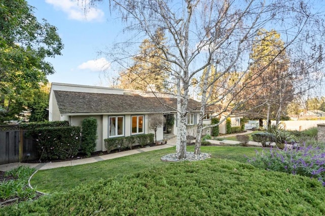 view of front of home with a front lawn