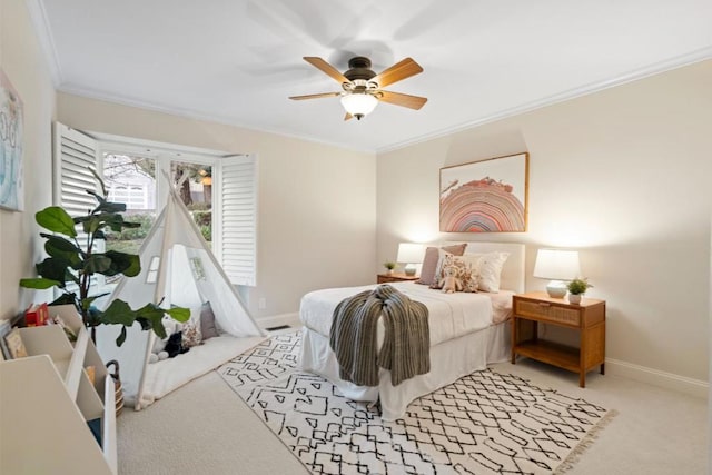 carpeted bedroom featuring ceiling fan and ornamental molding