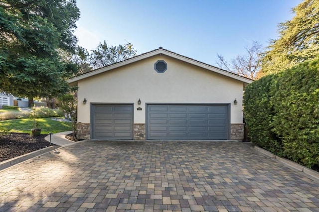 view of home's exterior featuring a garage and an outdoor structure