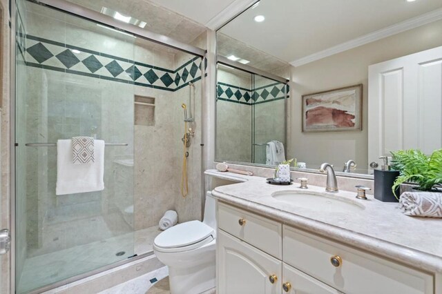 bathroom with crown molding, a shower with door, and vanity