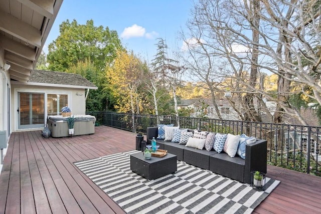 wooden terrace with an outdoor living space