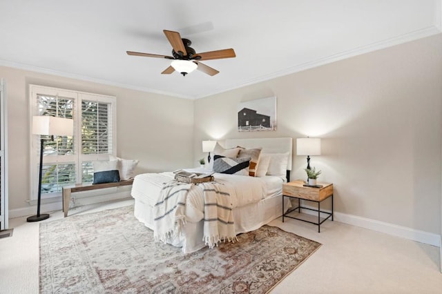 bedroom featuring ceiling fan, ornamental molding, and carpet floors