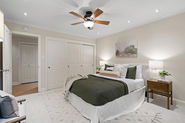 bedroom with ceiling fan and ornamental molding