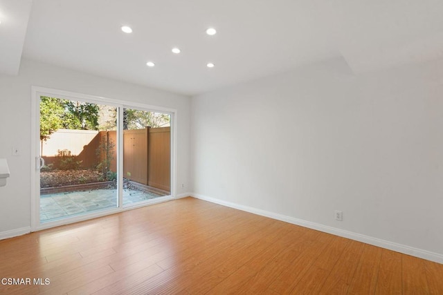 empty room with light hardwood / wood-style floors