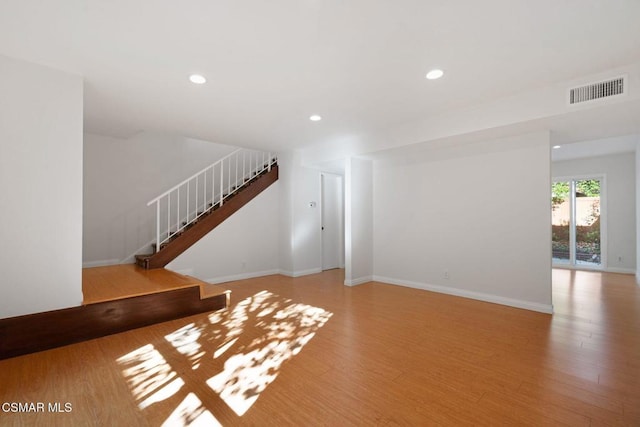 unfurnished living room featuring light wood-type flooring