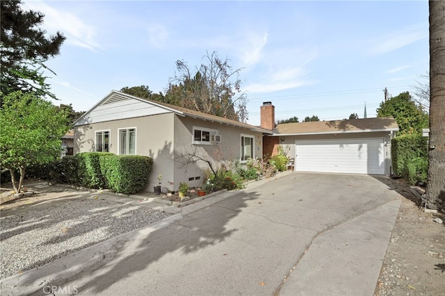 ranch-style home with a garage