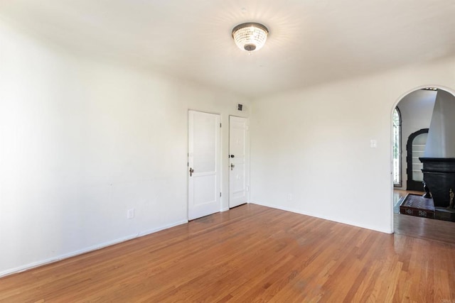 empty room featuring wood-type flooring