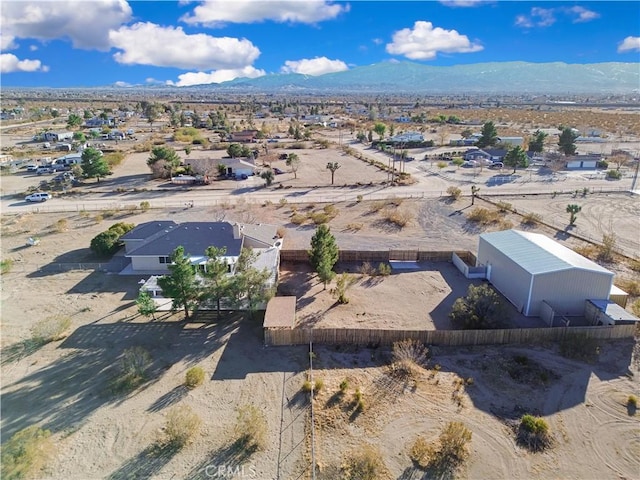 birds eye view of property with a mountain view