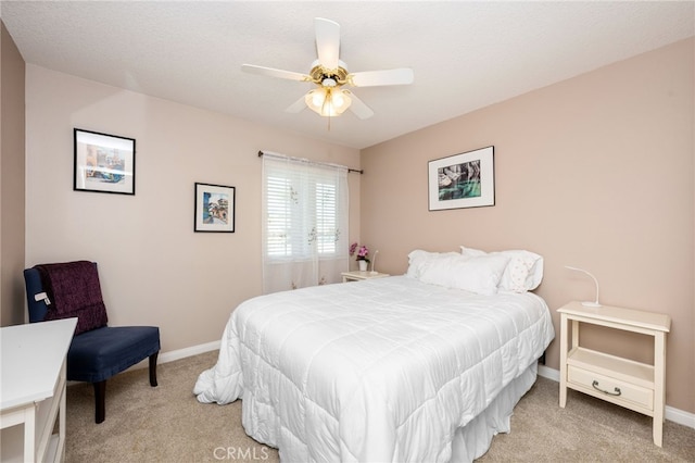 bedroom with light carpet and ceiling fan