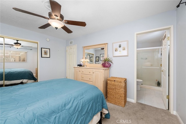 carpeted bedroom with ceiling fan, a closet, and connected bathroom