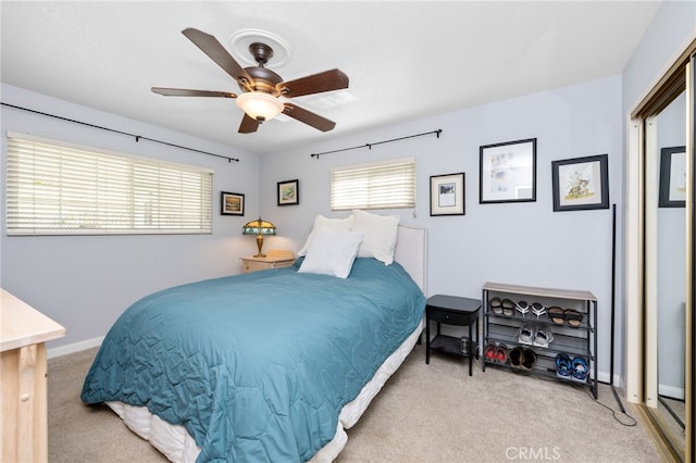 carpeted bedroom with ceiling fan