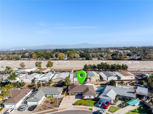 birds eye view of property featuring a mountain view