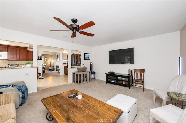 living room with ceiling fan