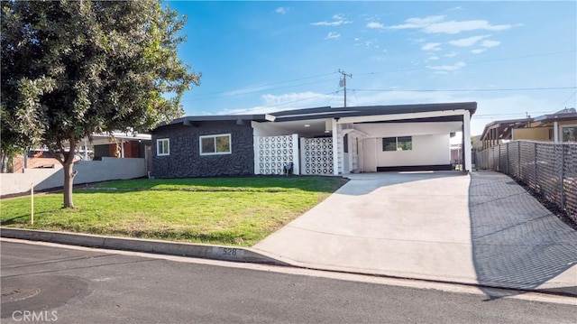 view of front of property with a carport and a front yard