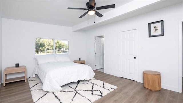 bedroom featuring ceiling fan and hardwood / wood-style floors