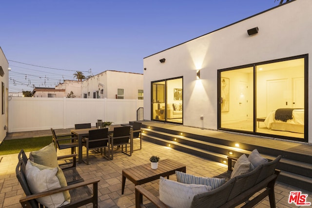 patio terrace at dusk with outdoor lounge area