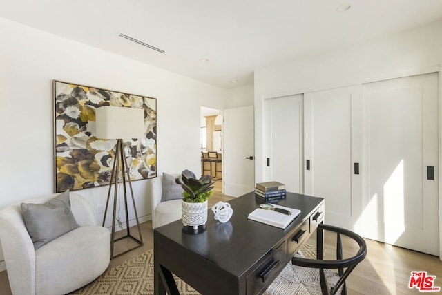 home office featuring light hardwood / wood-style floors