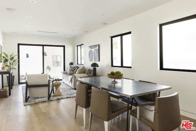 dining space featuring light hardwood / wood-style floors