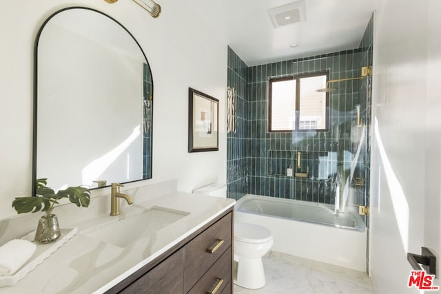 full bathroom featuring shower / bath combination with glass door, vanity, and toilet