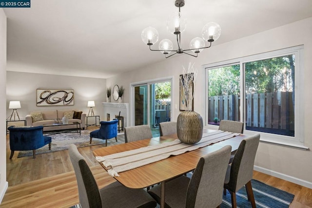 dining room featuring an inviting chandelier and light hardwood / wood-style floors