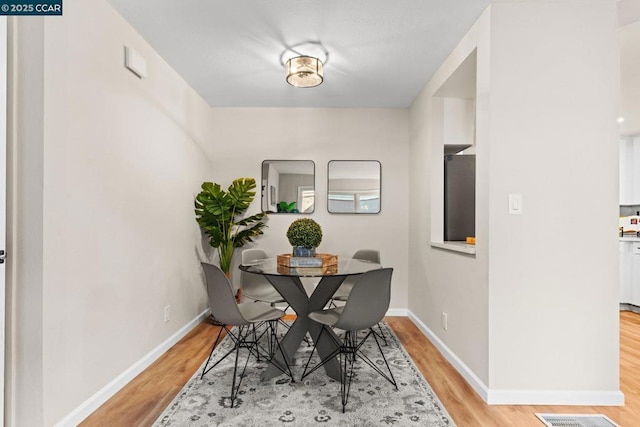 dining room with light hardwood / wood-style floors