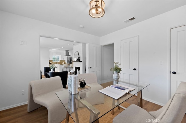 dining room with wood-type flooring