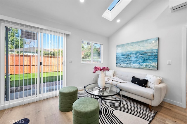 living room featuring light wood-type flooring and vaulted ceiling with skylight