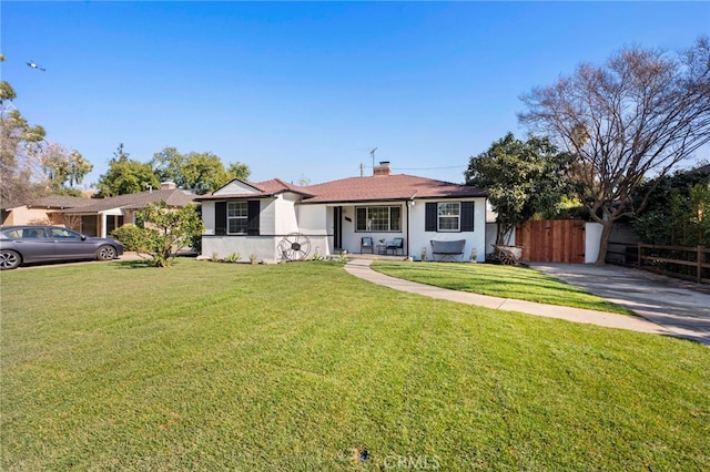 single story home with a front yard