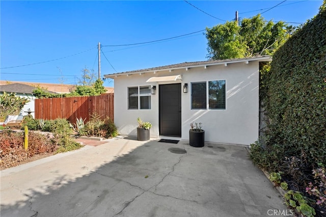 view of front of home with a patio