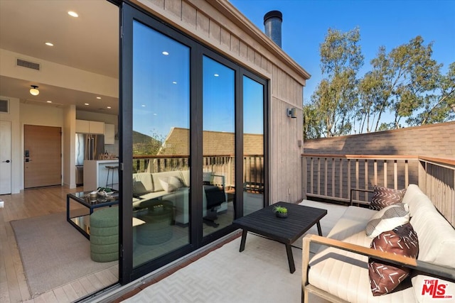 balcony with an outdoor hangout area