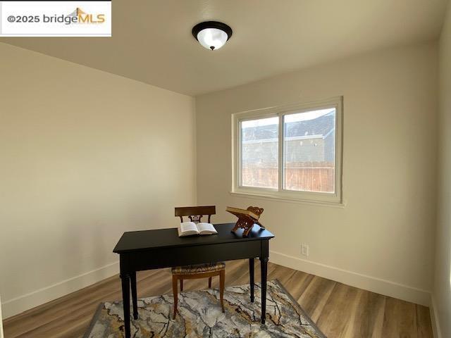 home office featuring hardwood / wood-style floors