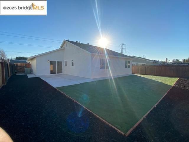 back of house featuring a patio