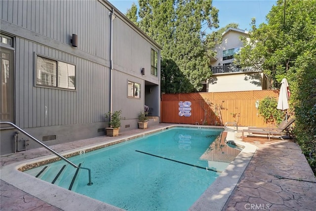 view of swimming pool featuring a patio