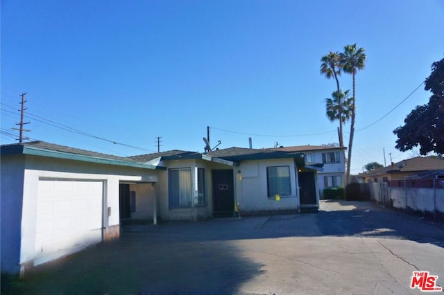 single story home featuring a garage