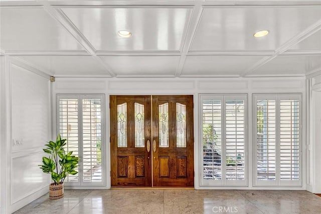 foyer entrance with coffered ceiling