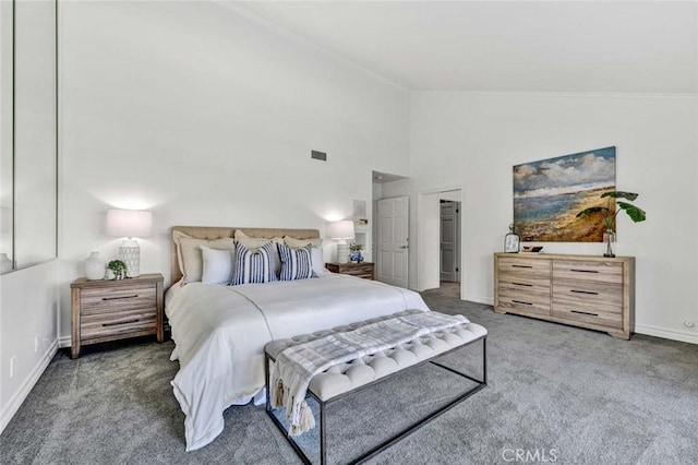 carpeted bedroom with high vaulted ceiling