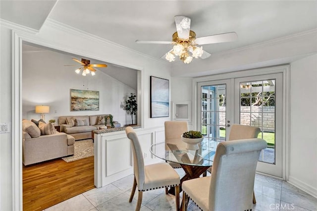 dining room with ceiling fan, french doors, crown molding, and light tile patterned floors