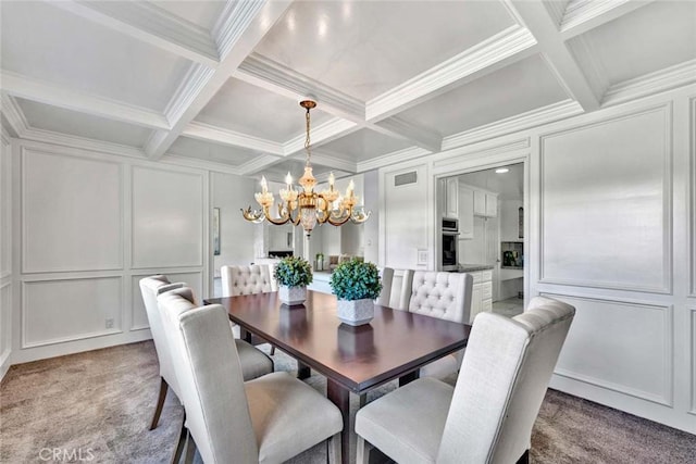 dining area with coffered ceiling, light colored carpet, a notable chandelier, and beamed ceiling