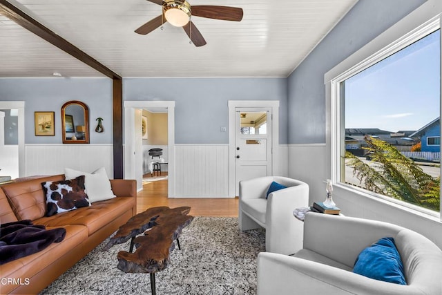 living room featuring ceiling fan and light hardwood / wood-style flooring