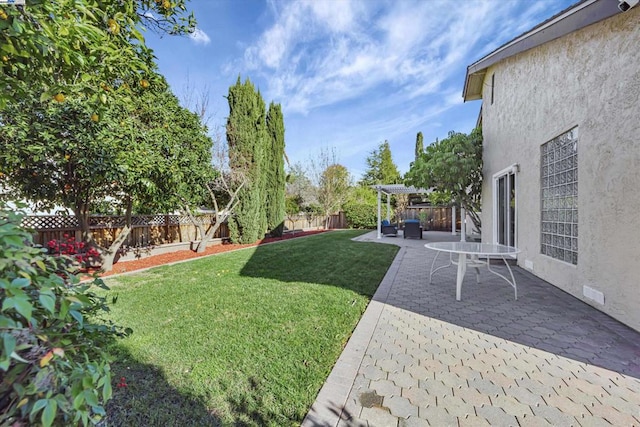 view of yard with a pergola and a patio