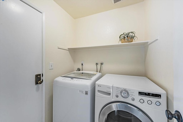 laundry area with washer and clothes dryer