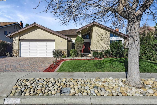 view of front facade with a front yard and a garage