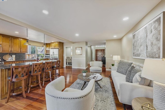 living room featuring dark wood-type flooring