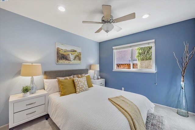 bedroom with ceiling fan and carpet floors