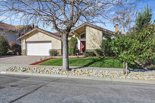 view of front facade with a garage and a front lawn