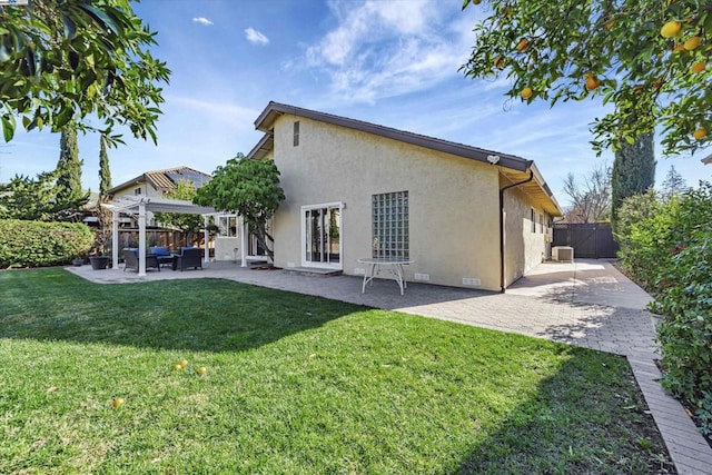 back of property with a pergola, outdoor lounge area, a yard, and a patio