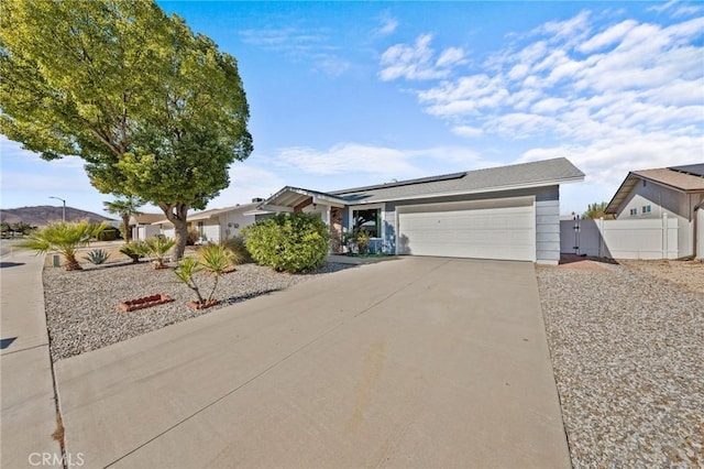 ranch-style house featuring a garage